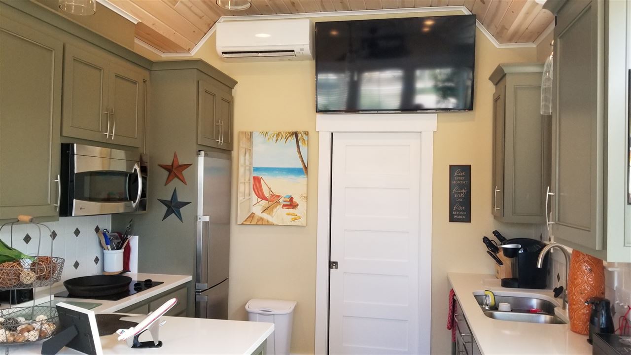 28888 Canal Road, Unit 68 Orange Beach, AL 36561 - Photo 5 of 18 Kitchen and TV