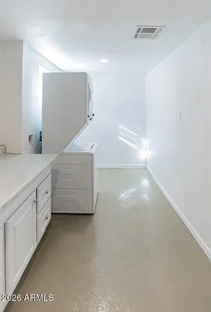 a bathroom with a toilet sink and a mirror