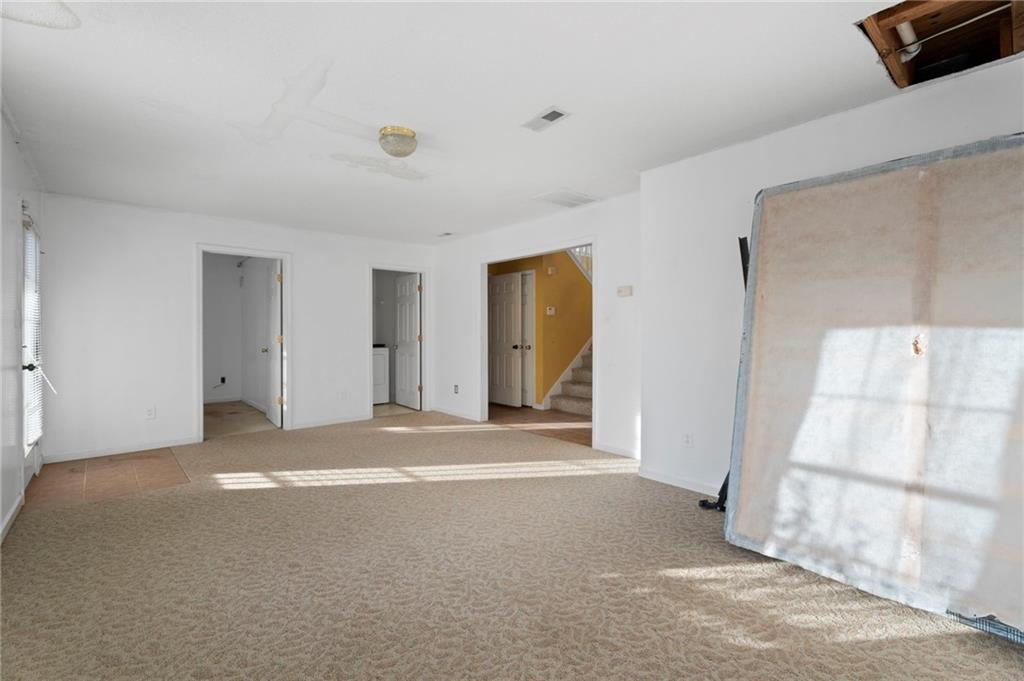6644 Virlyn B Smith Road Fairburn, GA 30213 - Photo 36 of 43 a view of a livingroom with an empty space and a window