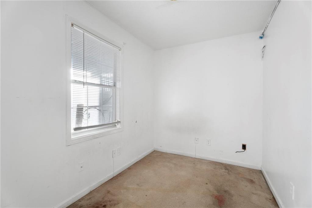 6644 Virlyn B Smith Road Fairburn, GA 30213 - Photo 37 of 43 an empty room with windows