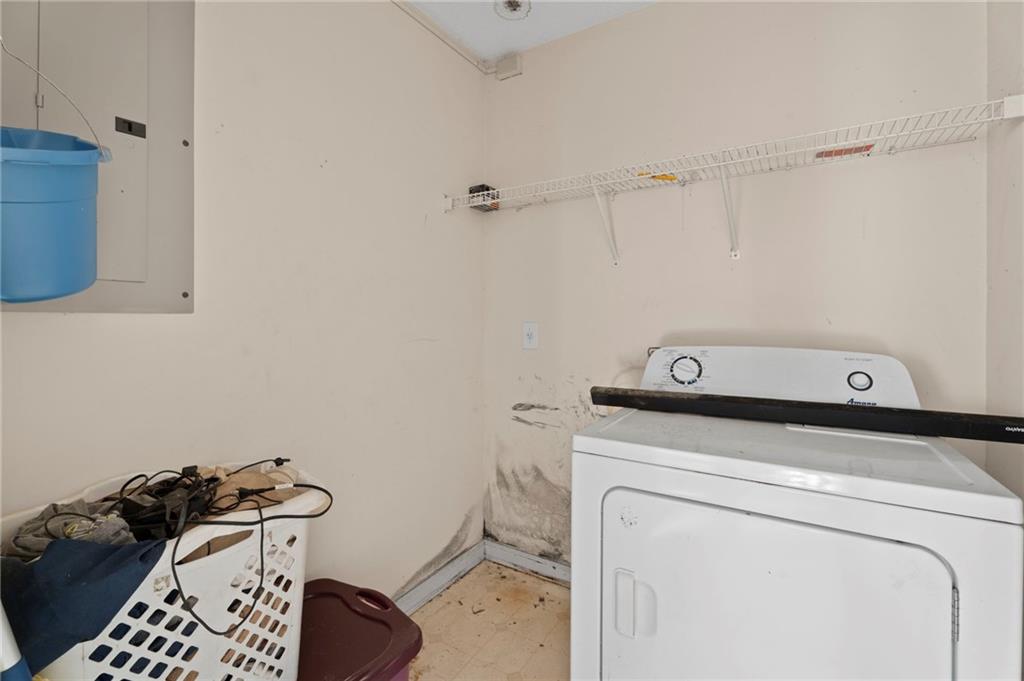 6644 Virlyn B Smith Road Fairburn, GA 30213 - Photo 39 of 43 a utility room with dryer and washer