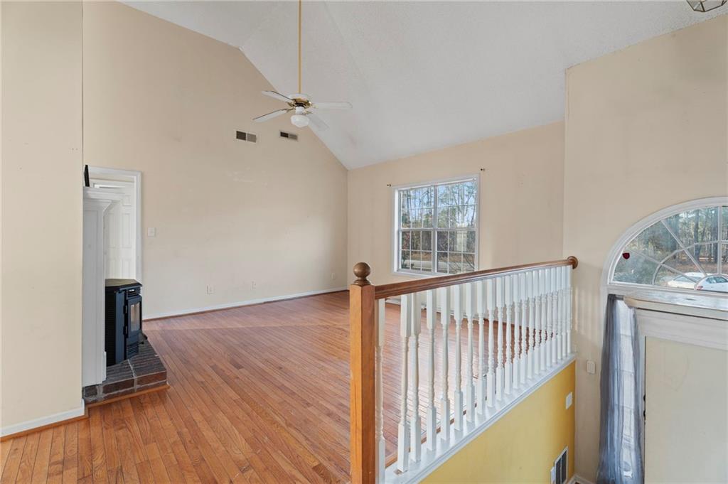 6644 Virlyn B Smith Road Fairburn, GA 30213 - Photo 7 of 43 a view of hallway with wooden floor and stairs