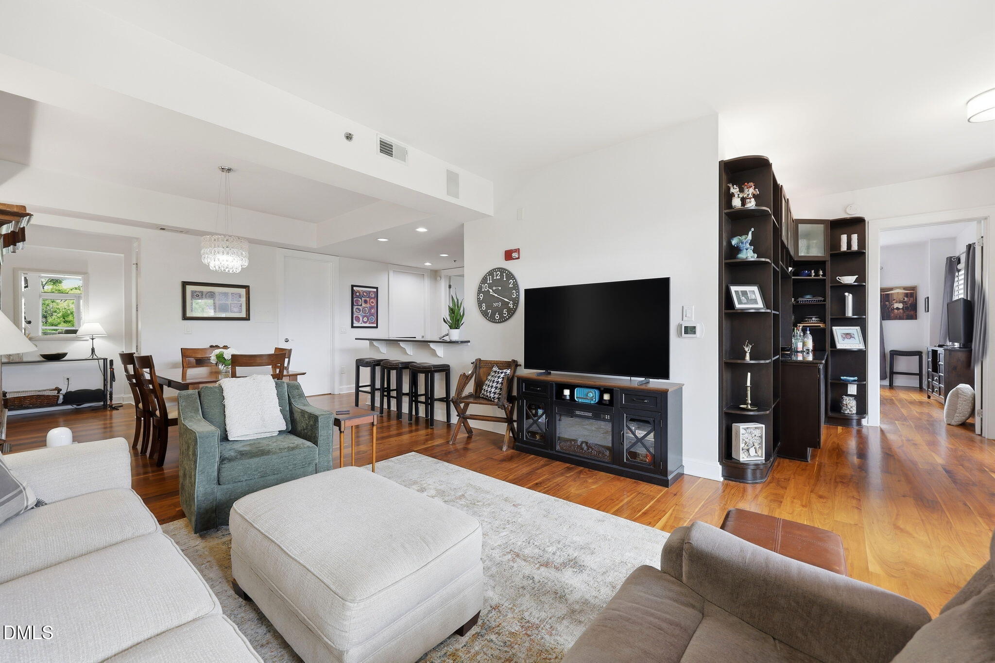 618 North Boylan Avenue, Unit 718 Raleigh, NC 27603 - Photo 7 of 38 a living room with furniture and a flat screen tv