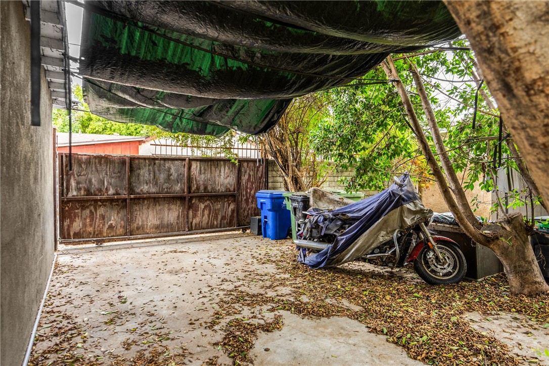 6957 Lindley Avenue Reseda, CA 91335 - Photo 25 of 27 a view of a backyard with a wooden fence