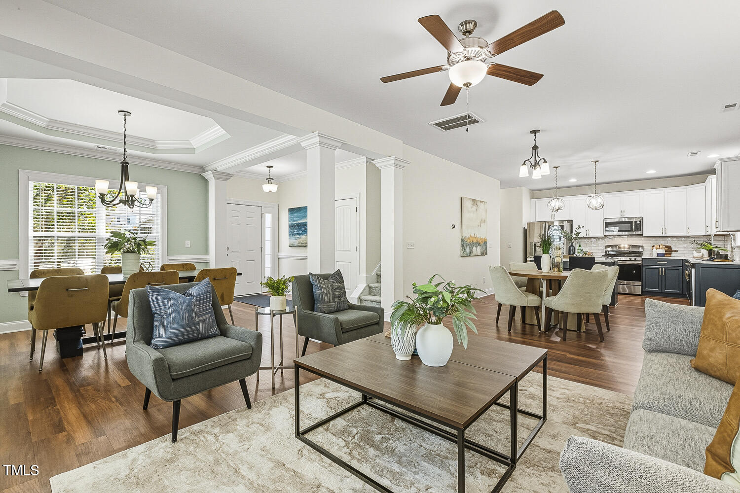 5180 Copain Cove Fuquay-Varina, NC 27526 - Photo 8 of 45 a living room with furniture kitchen view and a chandelier