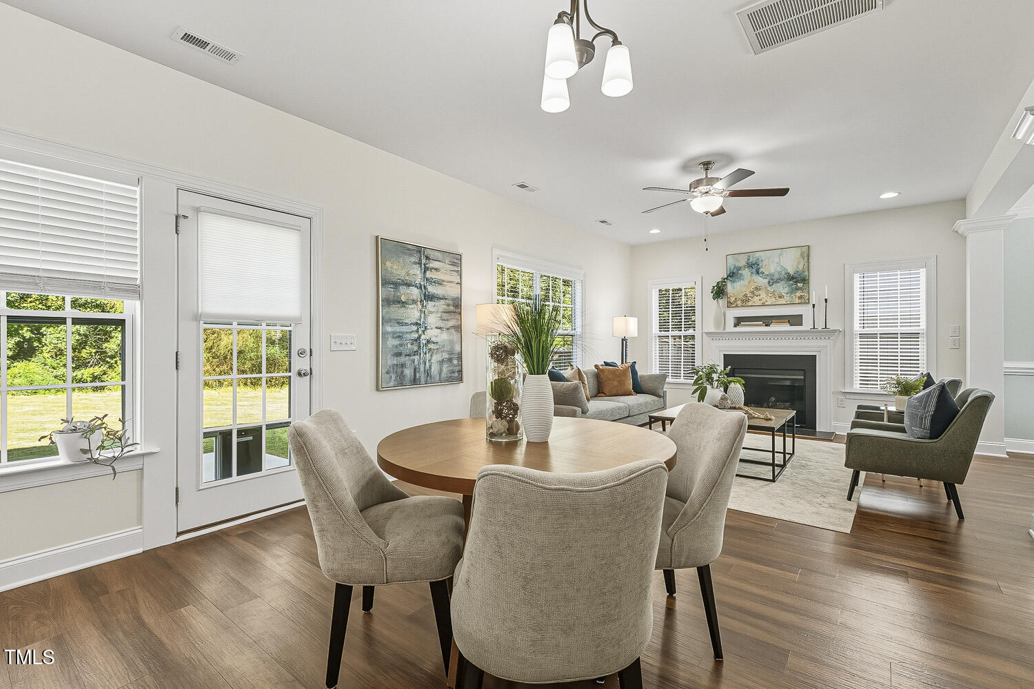 5180 Copain Cove Fuquay-Varina, NC 27526 - Photo 11 of 45 a view of a dining room with furniture window and wooden floor