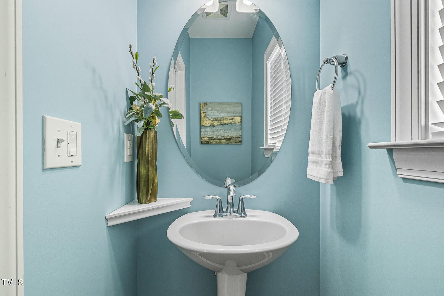 5180 Copain Cove Fuquay-Varina, NC 27526 - Photo 18 of 45 a bathroom with a sink and a mirror