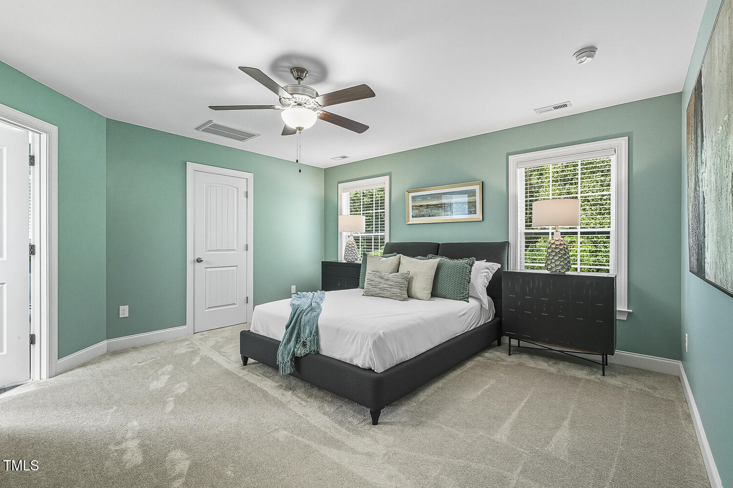 5180 Copain Cove Fuquay-Varina, NC 27526 - Photo 19 of 45 a bedroom with a bed lamp and a window