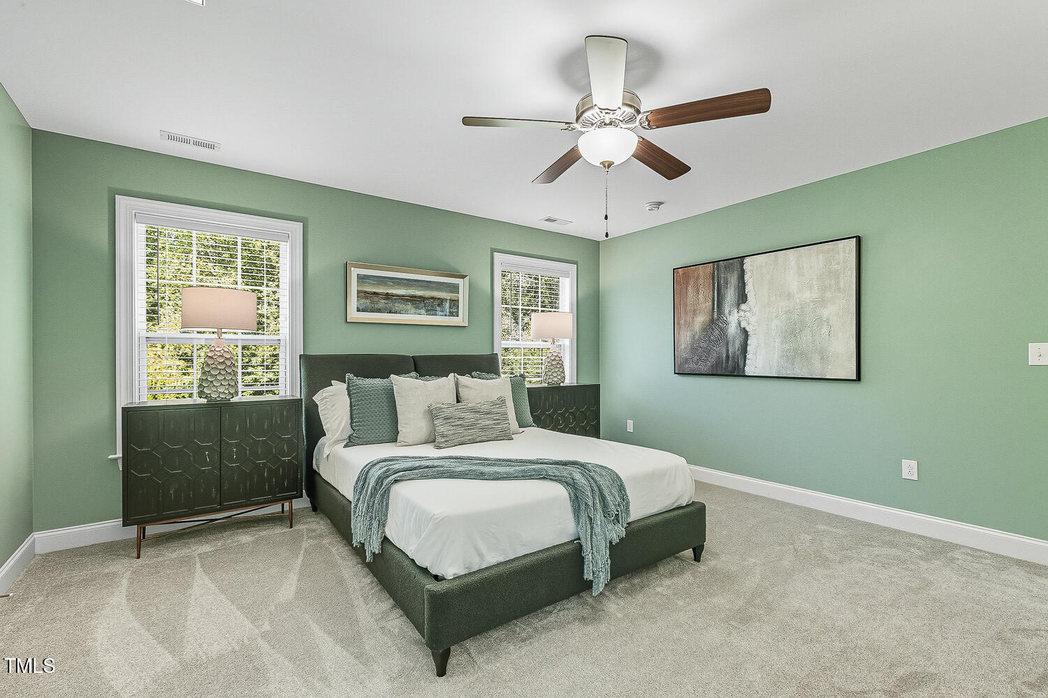 5180 Copain Cove Fuquay-Varina, NC 27526 - Photo 20 of 45 a bedroom with a bed and a chandelier