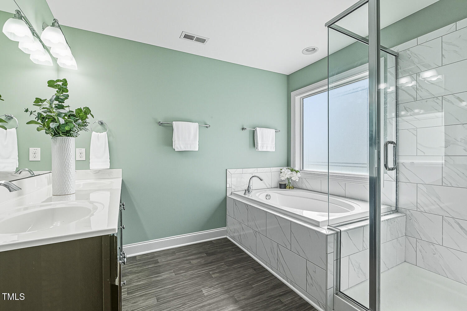 5180 Copain Cove Fuquay-Varina, NC 27526 - Photo 23 of 45 a bathroom with a tub sink and mirror