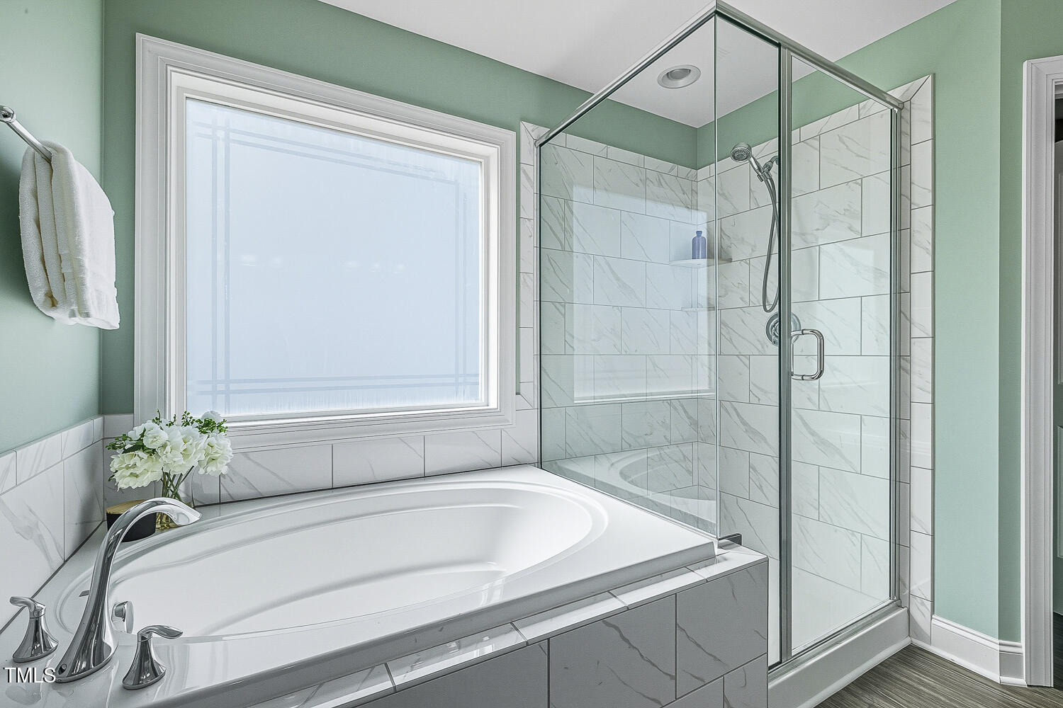 5180 Copain Cove Fuquay-Varina, NC 27526 - Photo 24 of 45 a bathroom with a tub and shower