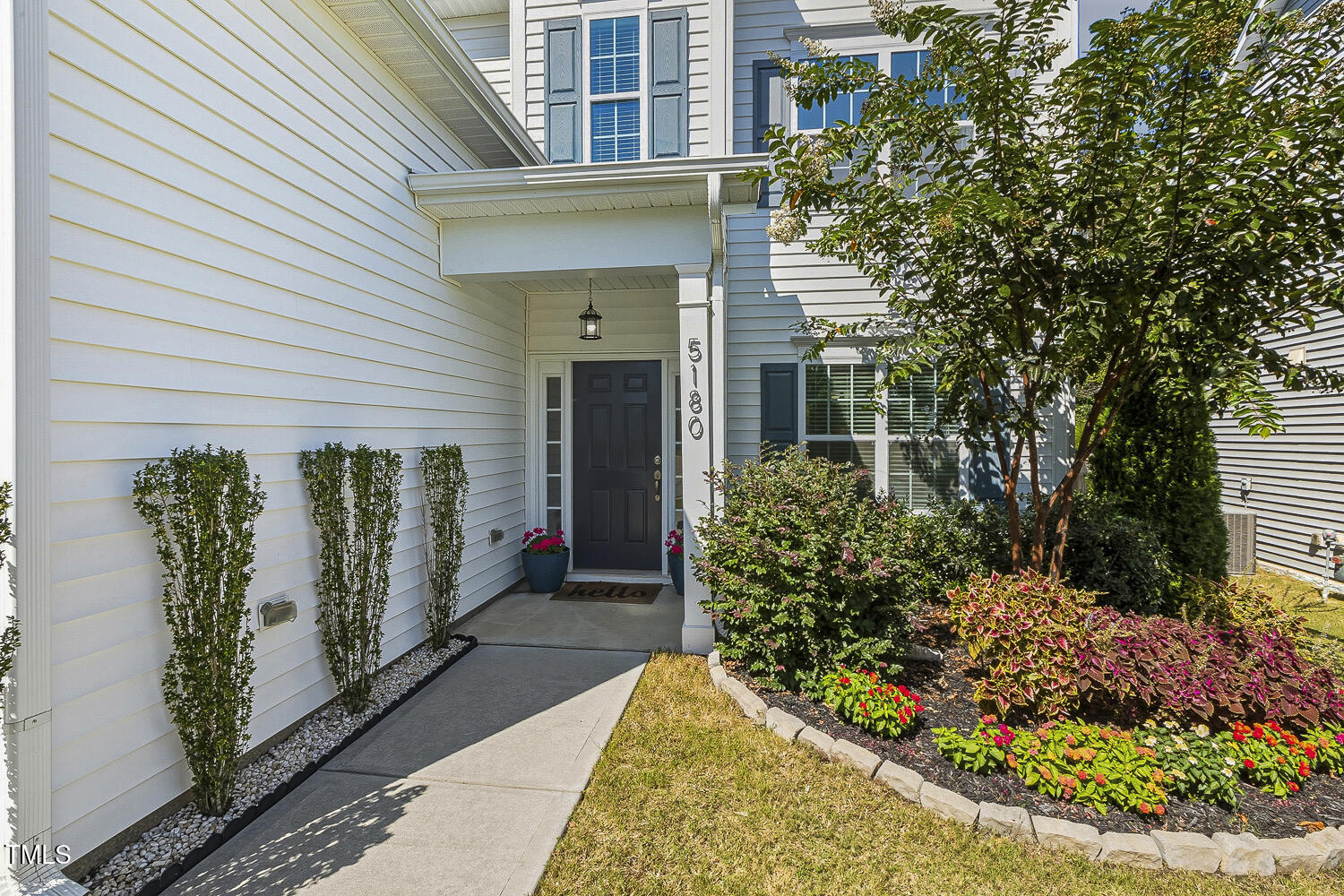 5180 Copain Cove Fuquay-Varina, NC 27526 - Photo 2 of 45 a view of a house with potted plants