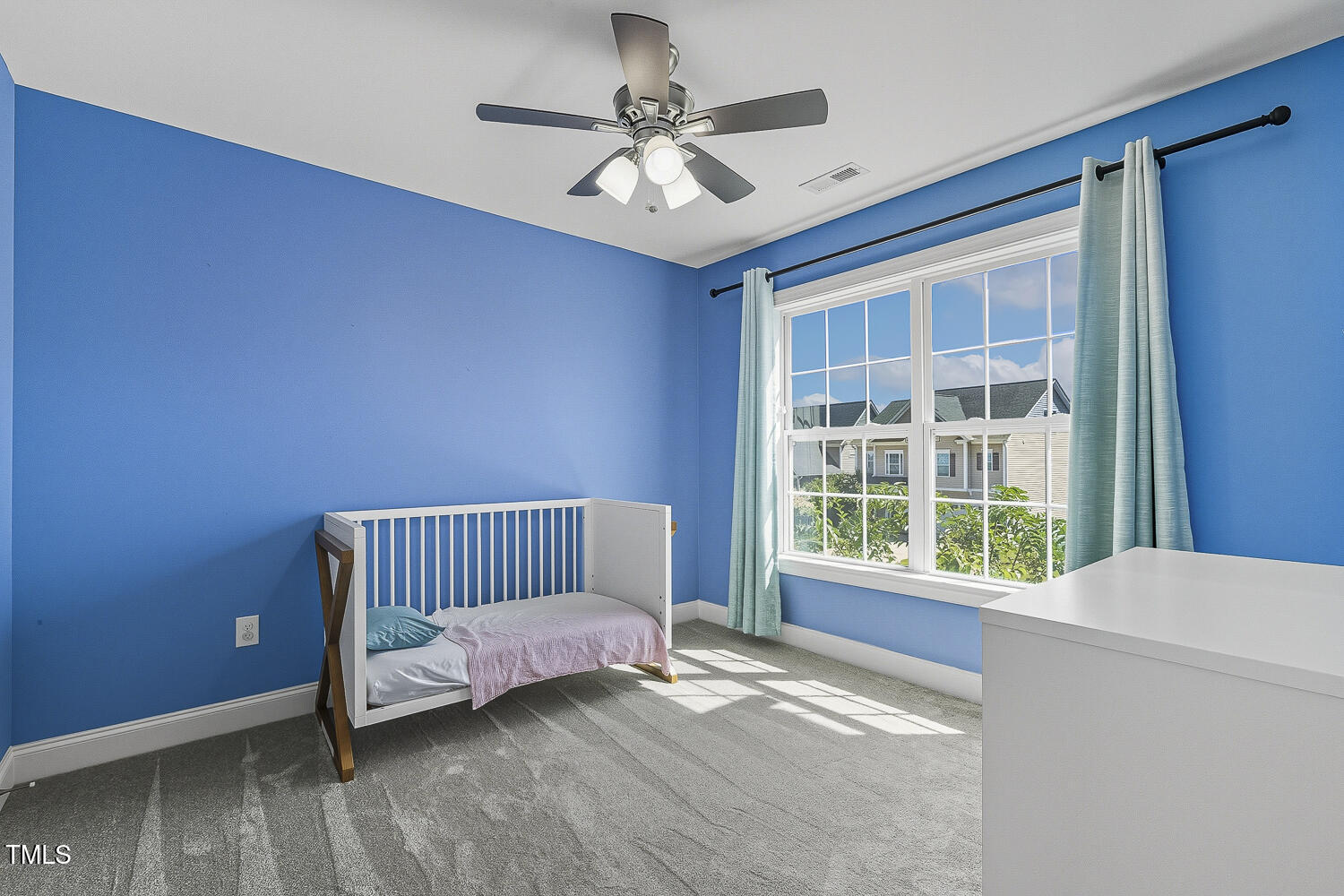 5180 Copain Cove Fuquay-Varina, NC 27526 - Photo 28 of 45 a view of a bedroom with a bed and a window