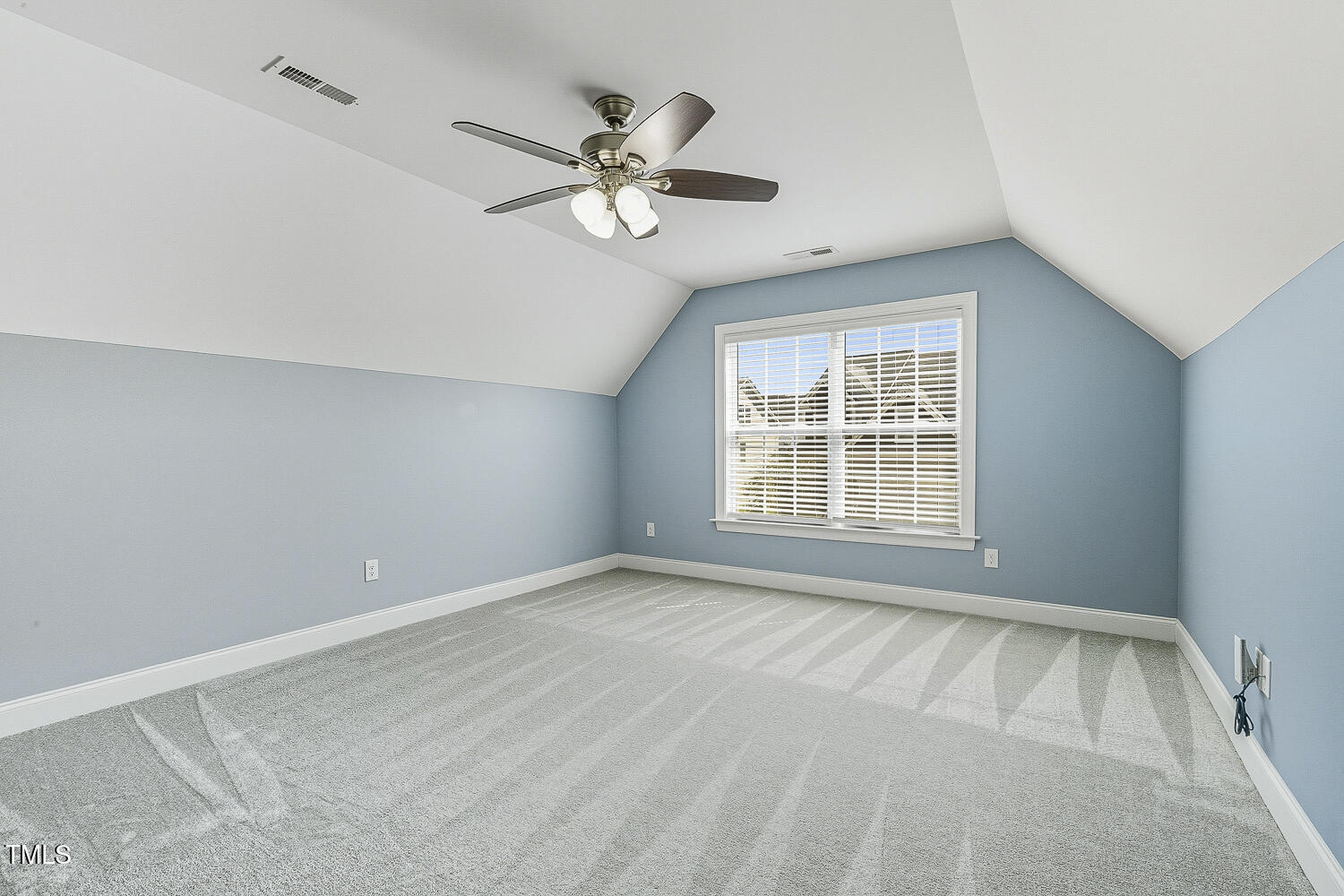 5180 Copain Cove Fuquay-Varina, NC 27526 - Photo 30 of 45 a view of an empty room with a window