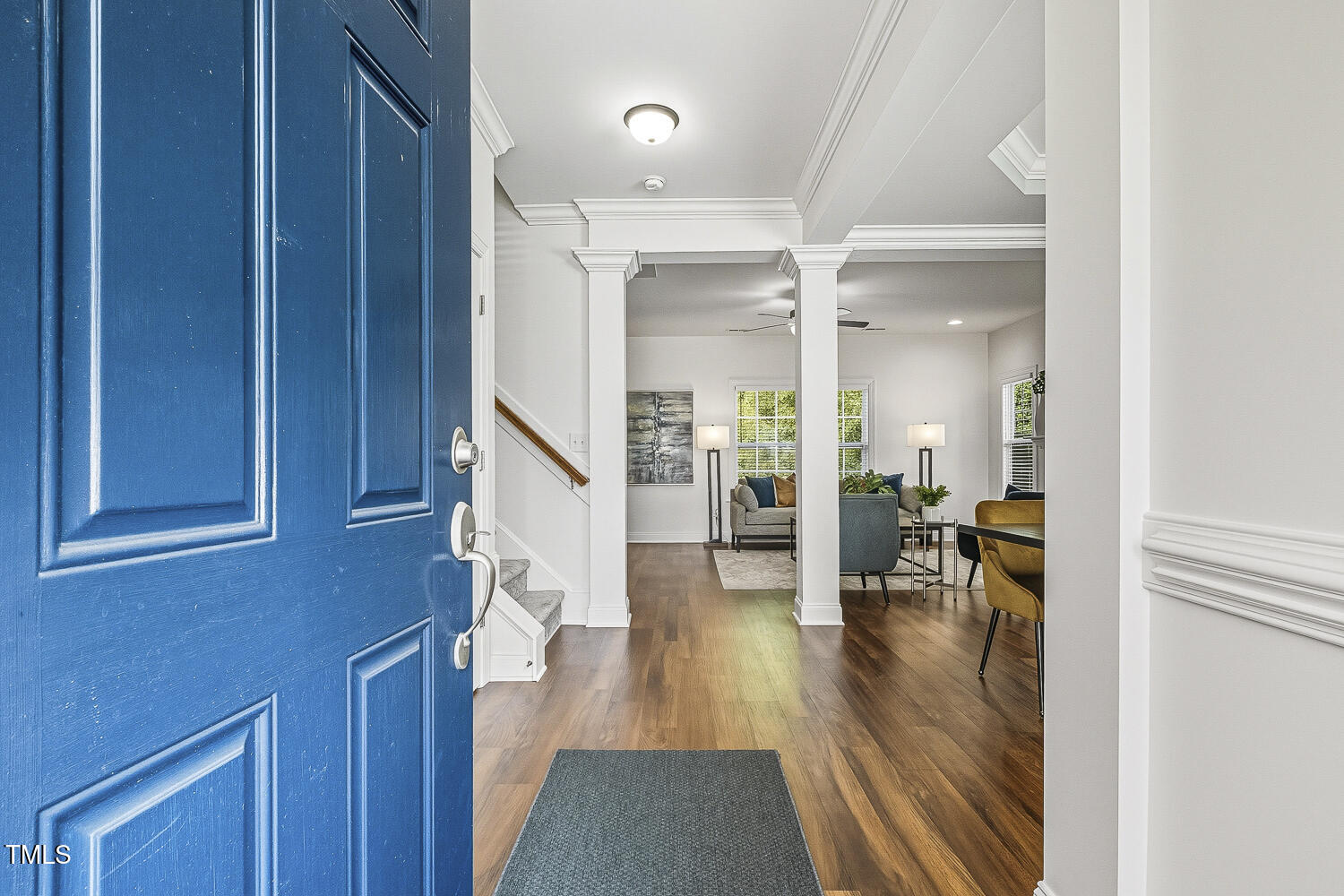 5180 Copain Cove Fuquay-Varina, NC 27526 - Photo 3 of 45 a hallway with wooden floor fireplace and dining room