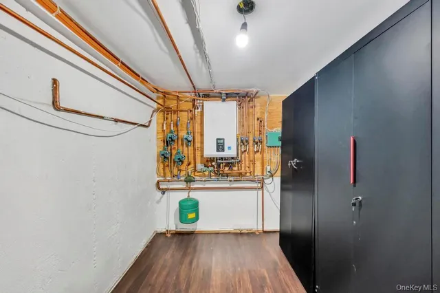 a kitchen with a window and wooden floor