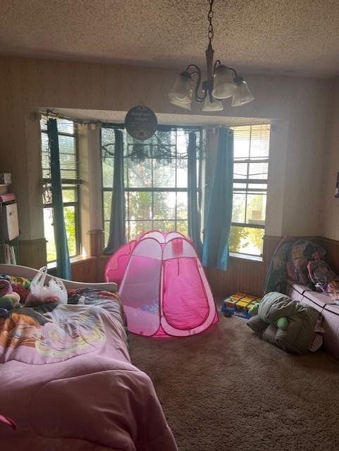 1500 Sharron Court Cleburne, TX 76033 - Photo 10 of 14 a bedroom with a bed and large windows