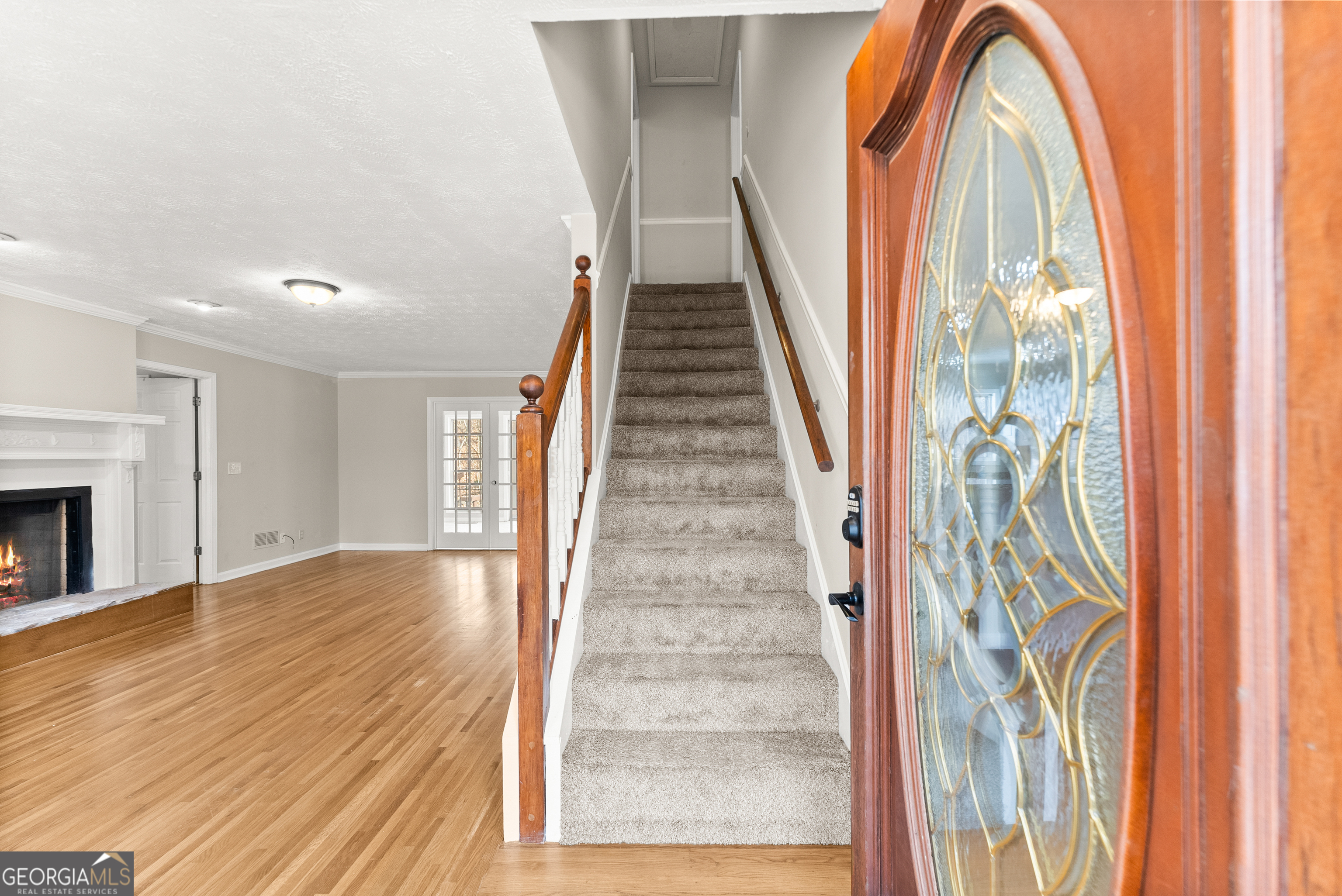 5011 Weaver Road Gainesville, GA 30507 - Photo 13 of 62 a view of a livingroom with wooden floor and stairs