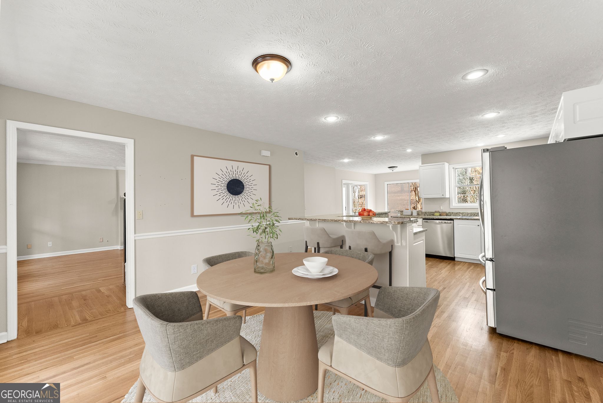 5011 Weaver Road Gainesville, GA 30507 - Photo 26 of 62 a kitchen with a dining table chairs and wooden floor