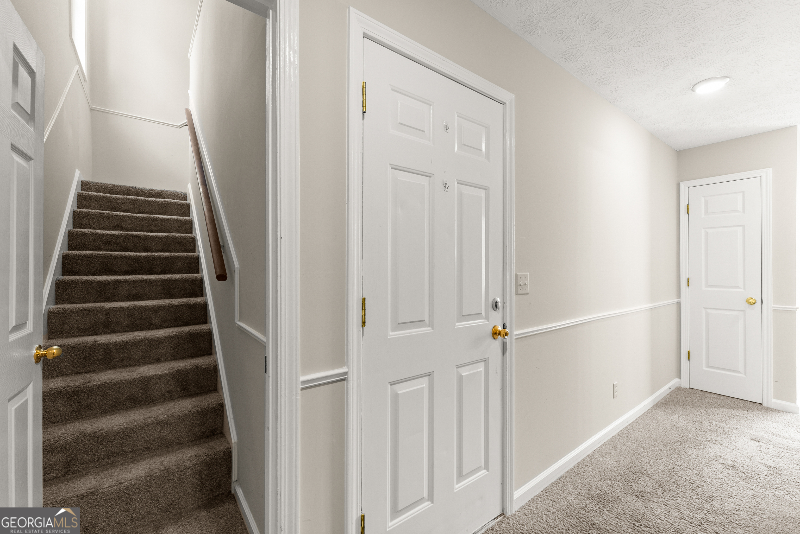 5011 Weaver Road Gainesville, GA 30507 - Photo 42 of 62 a view of a hallway with stairs