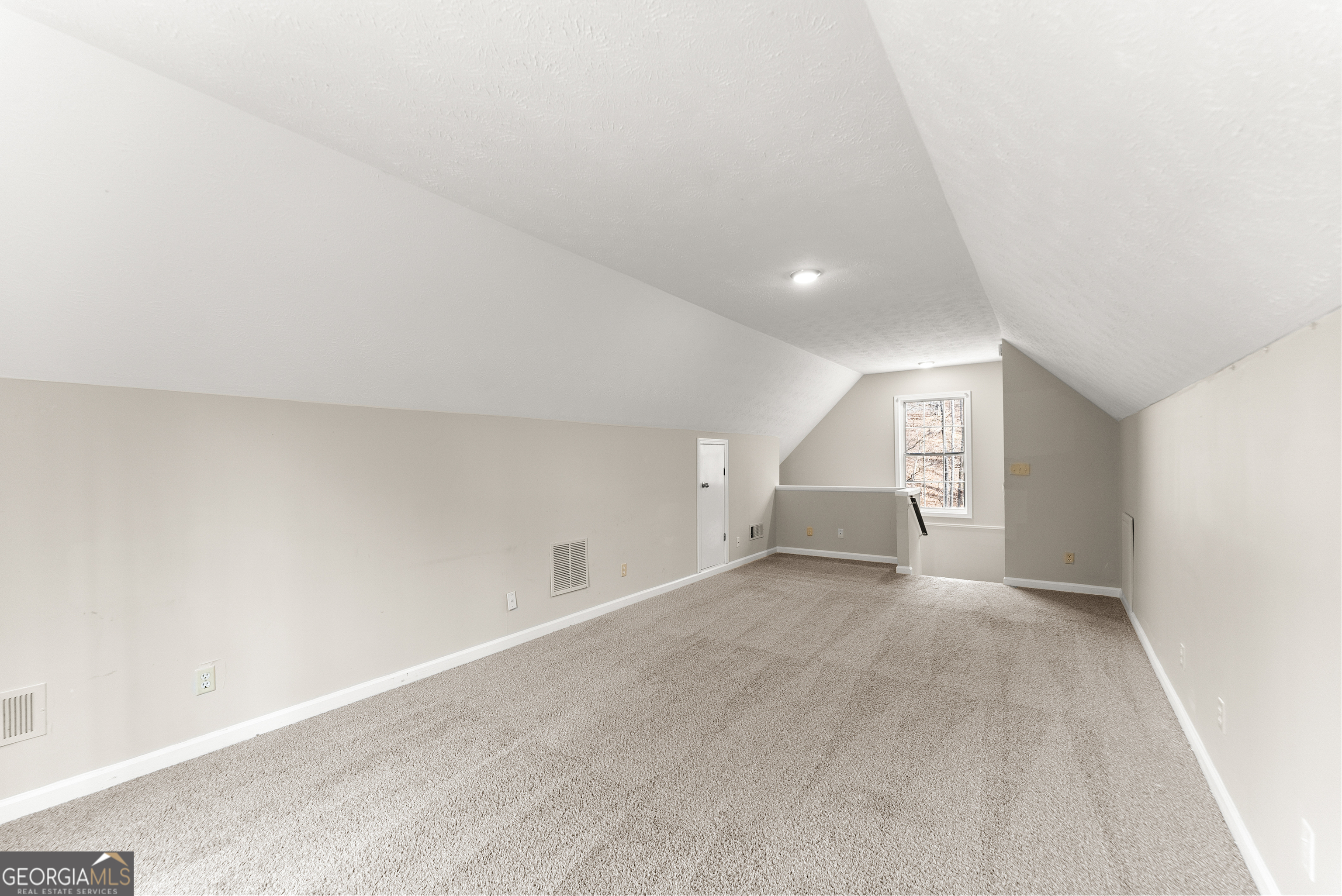 5011 Weaver Road Gainesville, GA 30507 - Photo 44 of 62 an empty room with a natural light