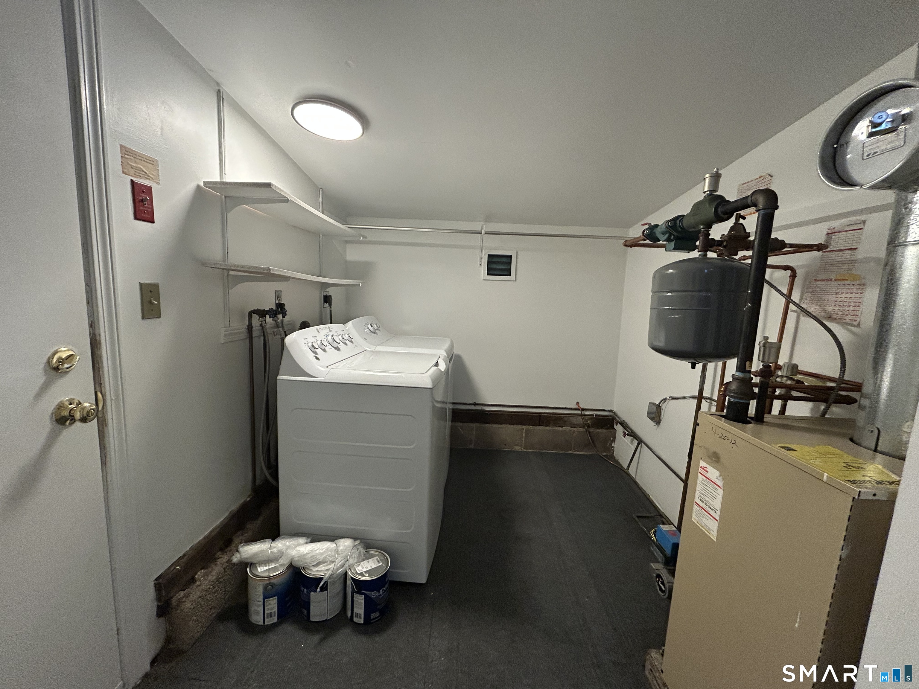 236 Wire Mill Road Stamford, CT 06903 - Photo 7 of 11 a room with a wooden floor and gym equipment
