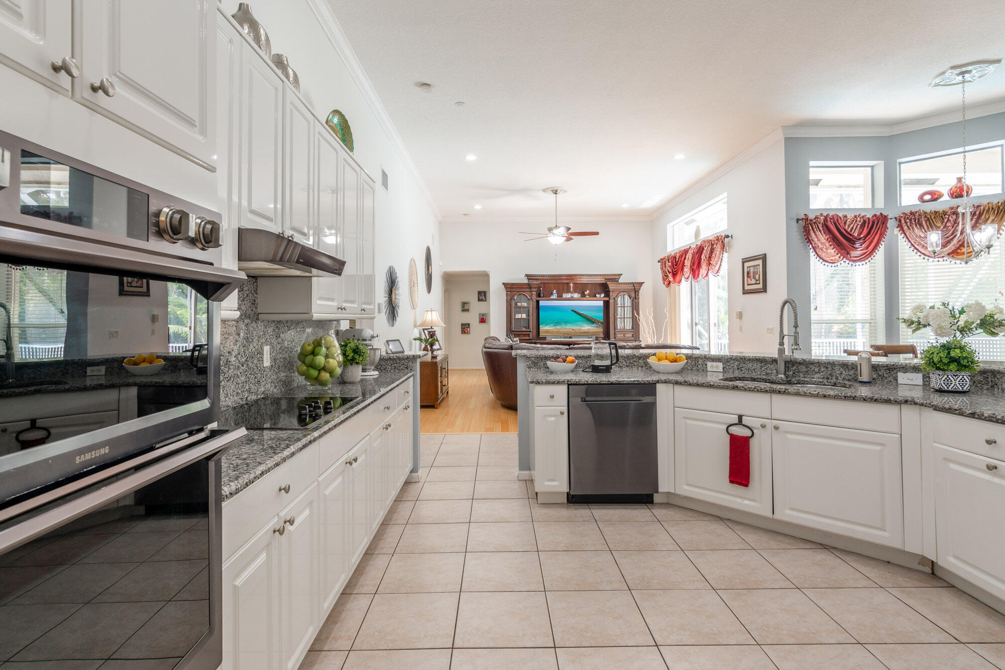 750 Cedar Cove Road Wellington, FL 33414 - Photo 11 of 37 a kitchen with stainless steel appliances granite countertop a stove and a sink