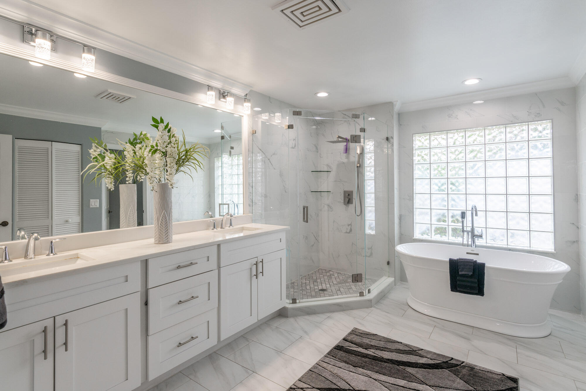 750 Cedar Cove Road Wellington, FL 33414 - Photo 19 of 37 a spacious bathroom with a sink double vanity granite tub shower and a mirror