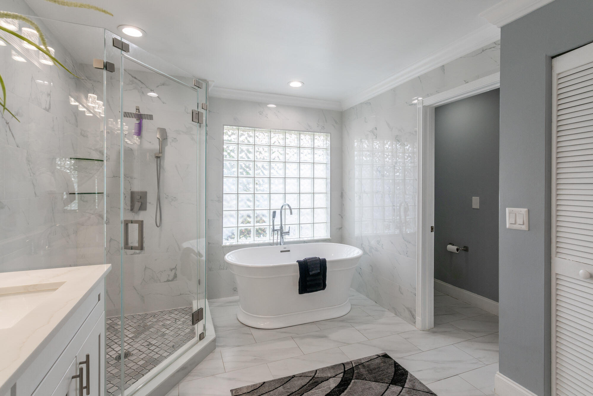 750 Cedar Cove Road Wellington, FL 33414 - Photo 20 of 37 a bathroom with a granite countertop sink a toilet and shower
