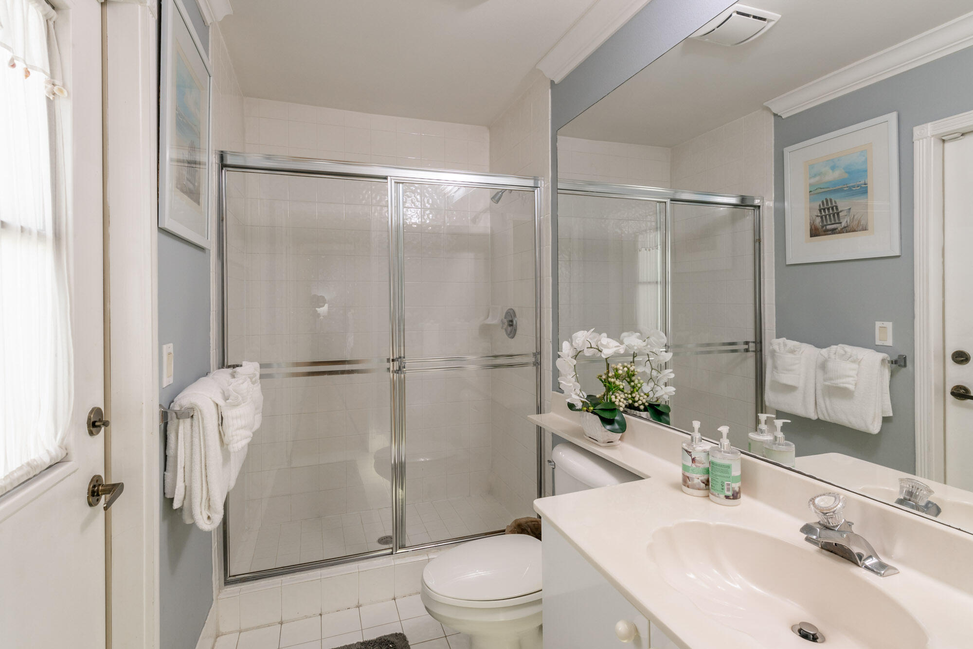 750 Cedar Cove Road Wellington, FL 33414 - Photo 22 of 37 a bathroom with a shower sink vanity mirror and toilet
