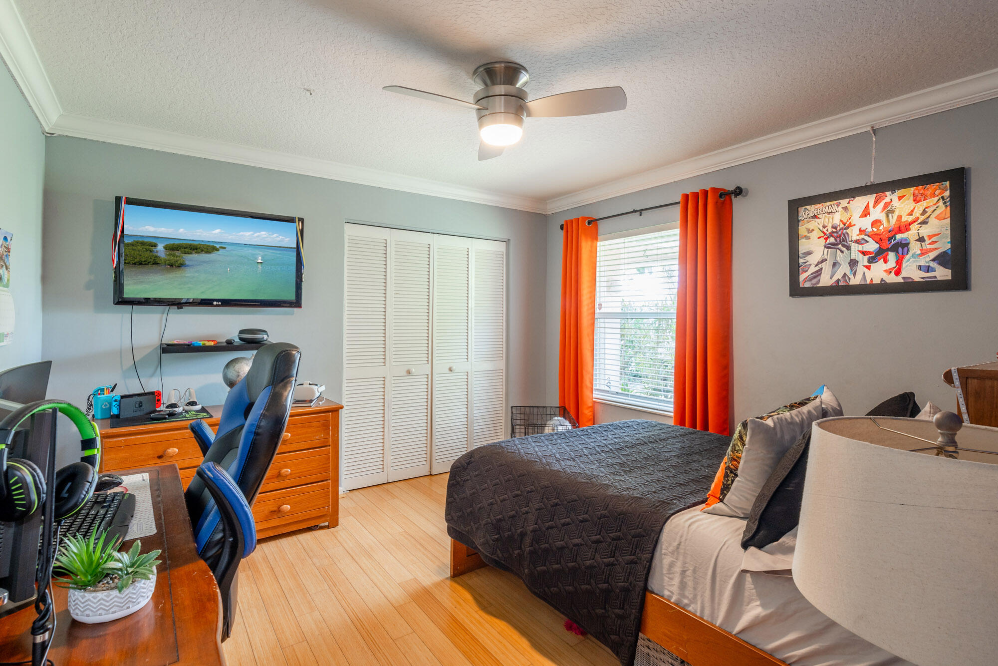 750 Cedar Cove Road Wellington, FL 33414 - Photo 25 of 37 a bedroom with furniture and a flat screen tv