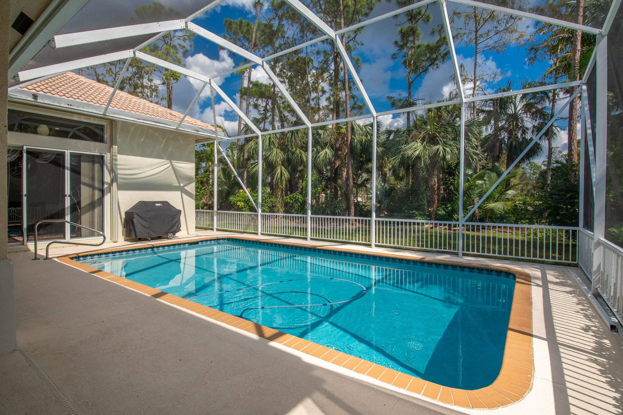 750 Cedar Cove Road Wellington, FL 33414 - Photo 29 of 37 a view of a backyard with a swimming pool