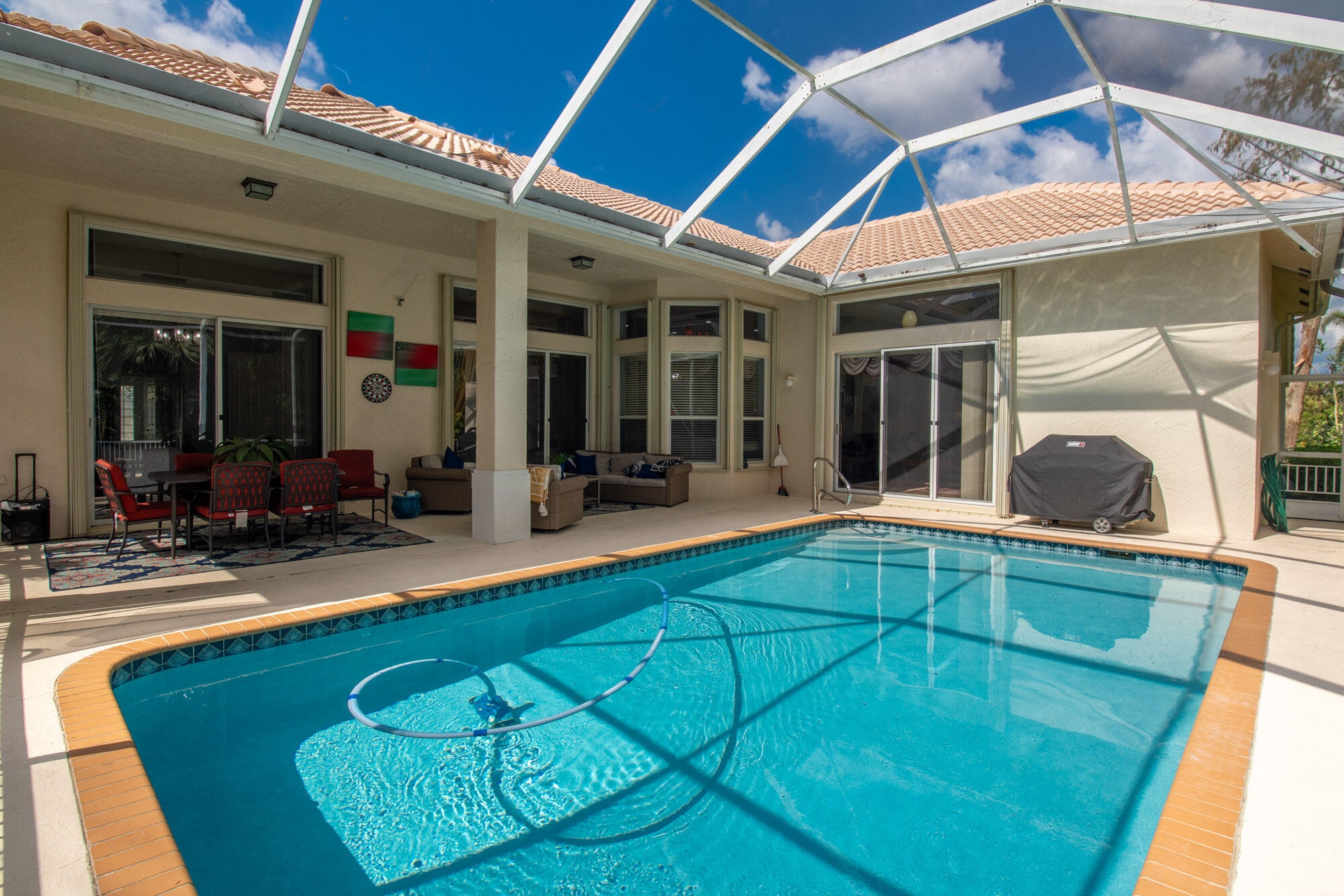 750 Cedar Cove Road Wellington, FL 33414 - Photo 30 of 37 a view of a dinning room with a backyard