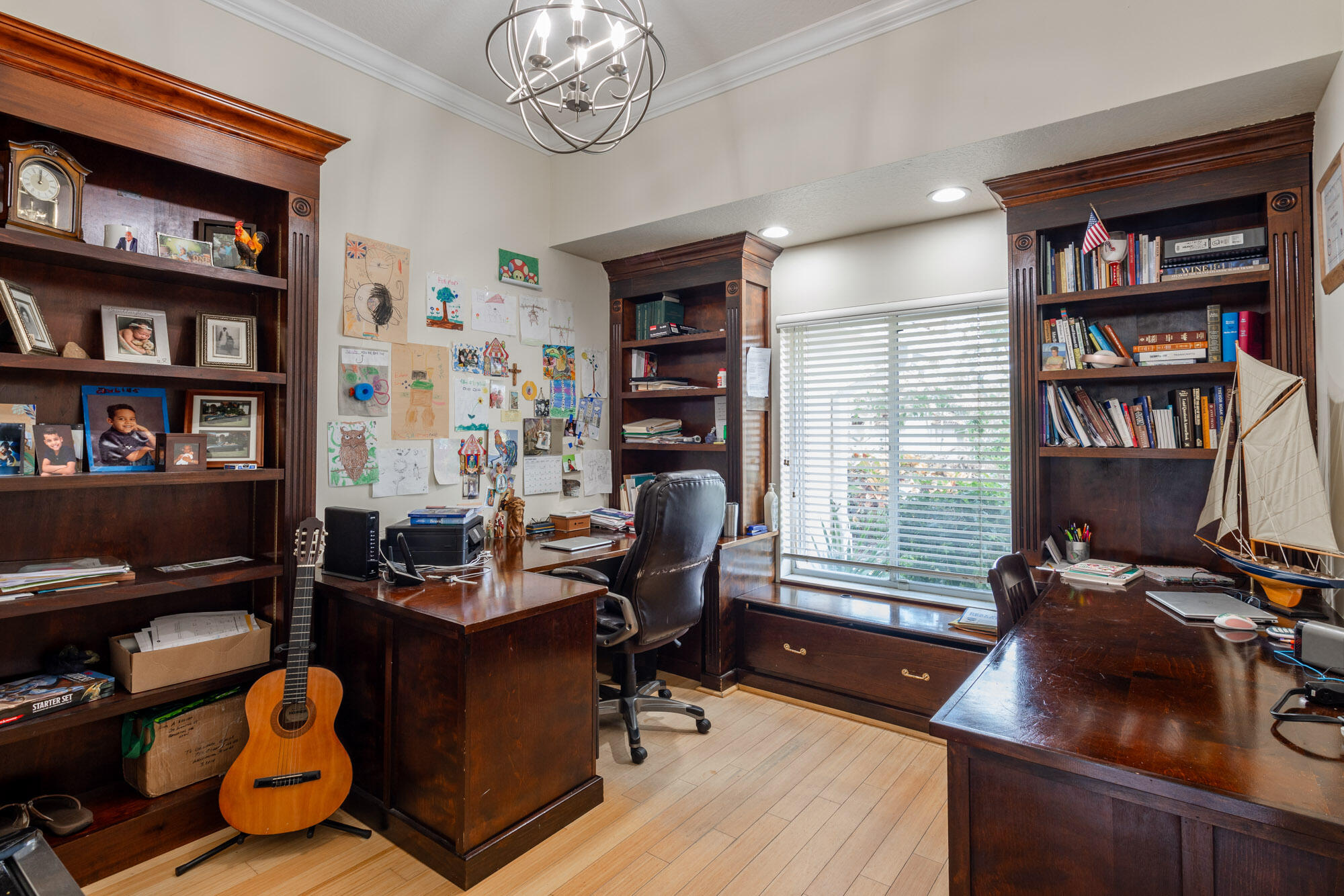 750 Cedar Cove Road Wellington, FL 33414 - Photo 7 of 37 a view of a workspace with furniture and a bookshelf