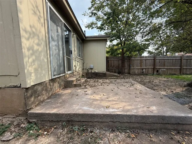 a view of a backyard of the house