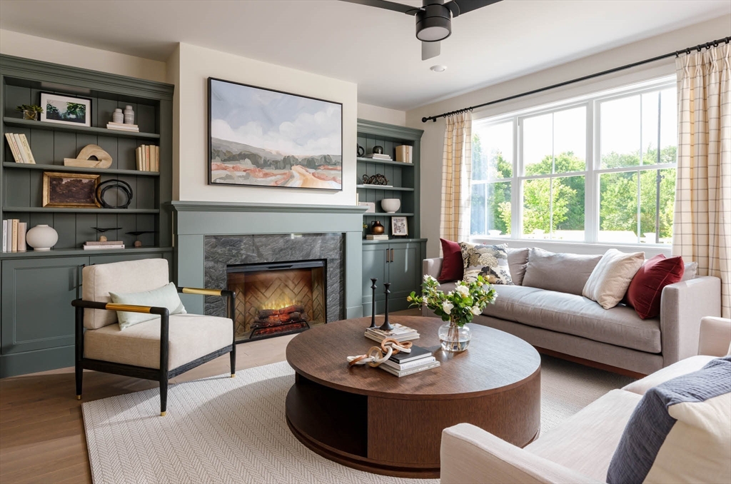 a living room with furniture and a fireplace