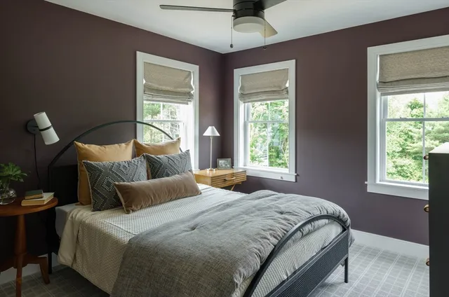 a bedroom with bed and window