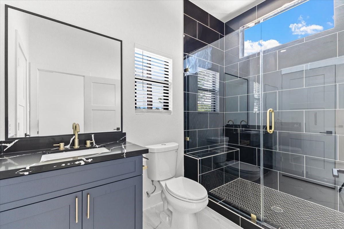 5110 Longmeadow Street, Unit B Houston, TX 77033 - Photo 17 of 25 a bathroom with a sink toilet and shower