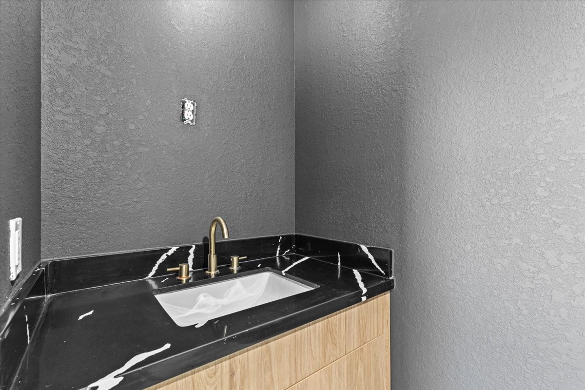 5110 Longmeadow Street, Unit B Houston, TX 77033 - Photo 24 of 25 a close view of sink and tap