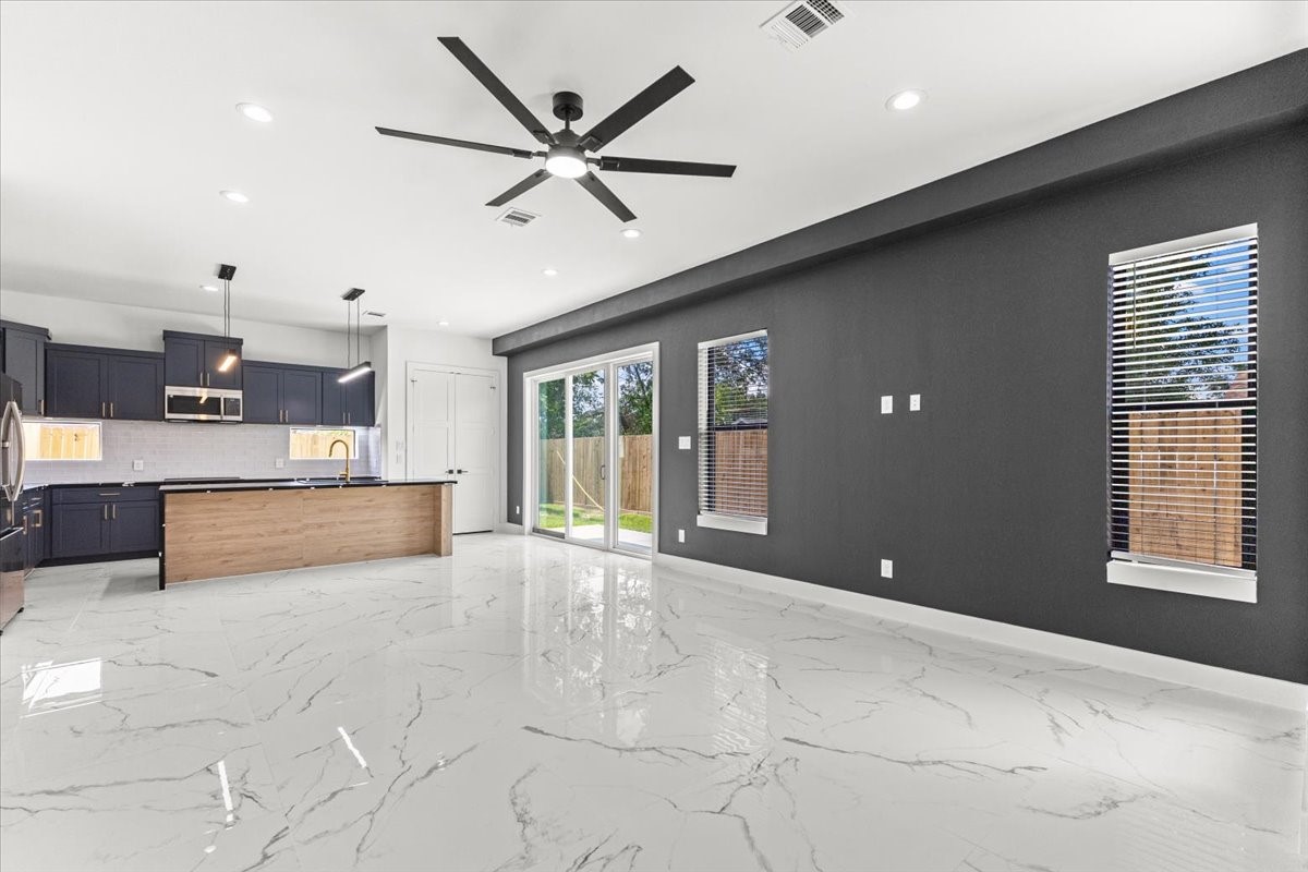 5110 Longmeadow Street, Unit B Houston, TX 77033 - Photo 7 of 25 a large hall with a large window and chandelier