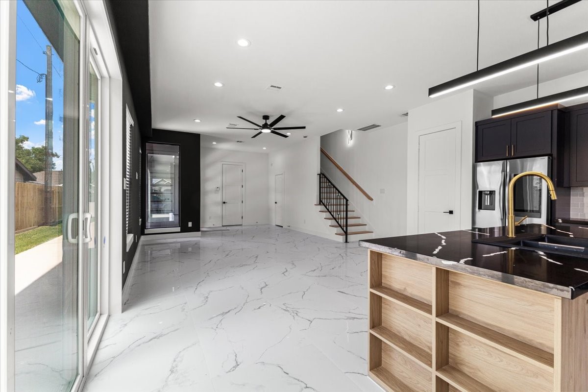 5110 Longmeadow Street, Unit B Houston, TX 77033 - Photo 8 of 25 a kitchen with a sink and cabinets