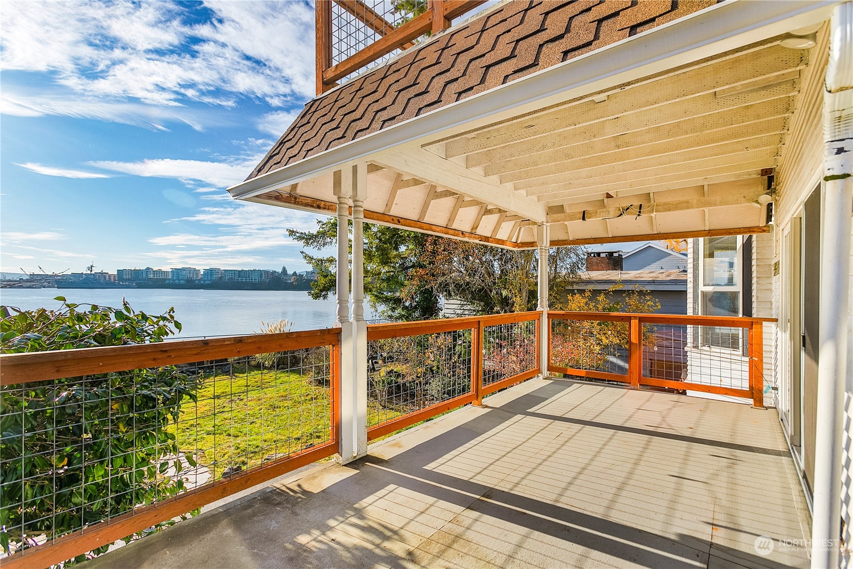 315 Shore Drive Bremerton, WA 98310 - Photo 35 of 38 a view of a balcony with floor to ceiling windows with wooden floor