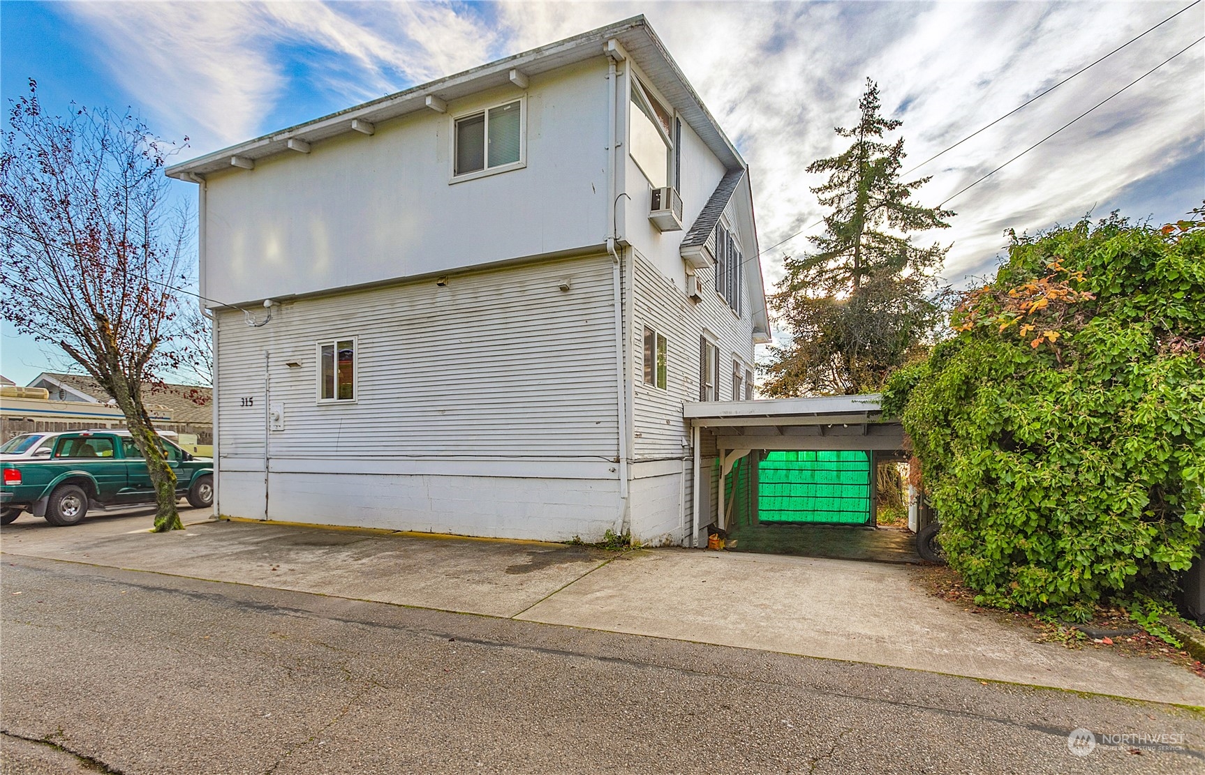 315 Shore Drive Bremerton, WA 98310 - Photo 37 of 38 a front view of a house with a yard and garage
