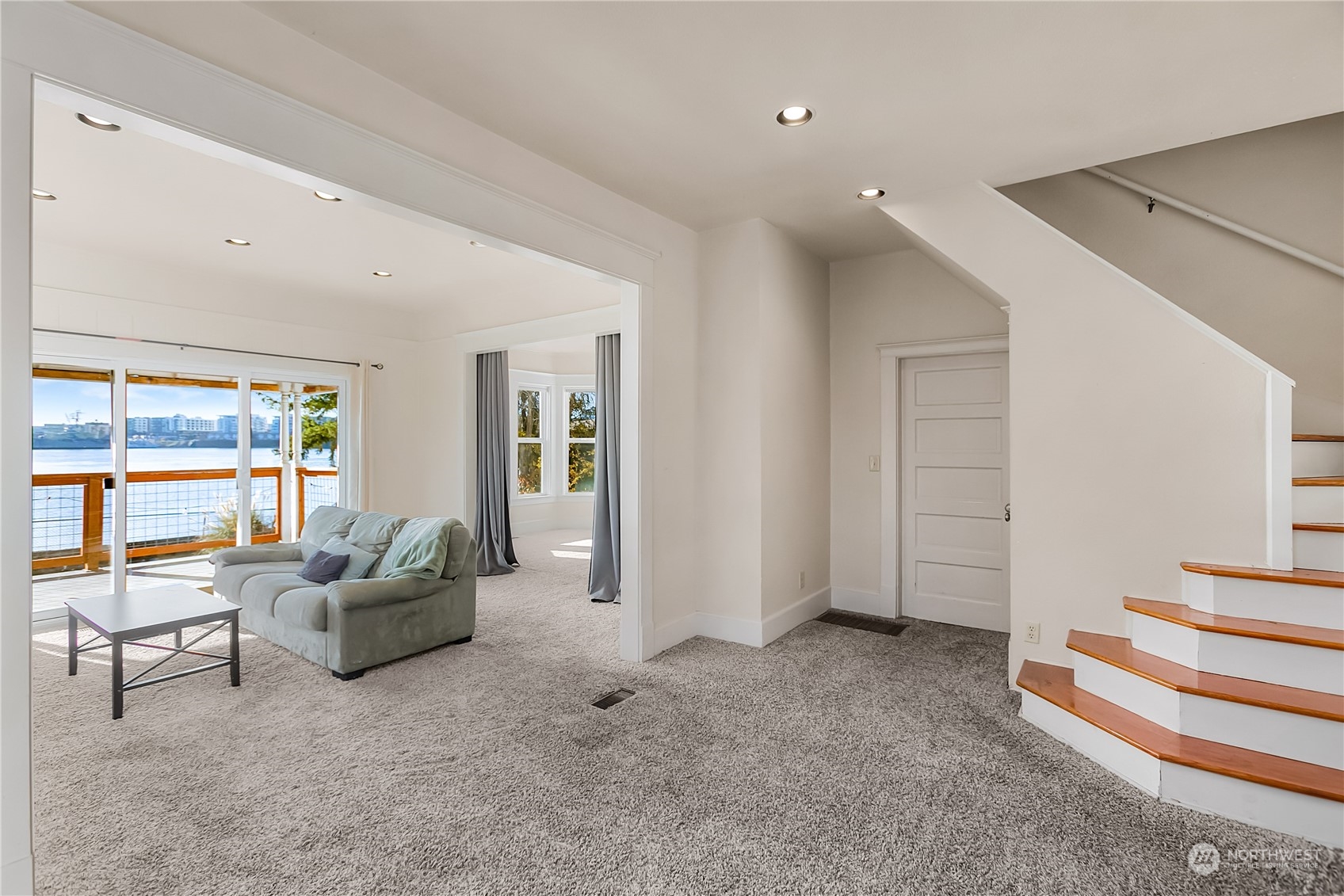 315 Shore Drive Bremerton, WA 98310 - Photo 9 of 38 a living room with furniture and a floor to ceiling window