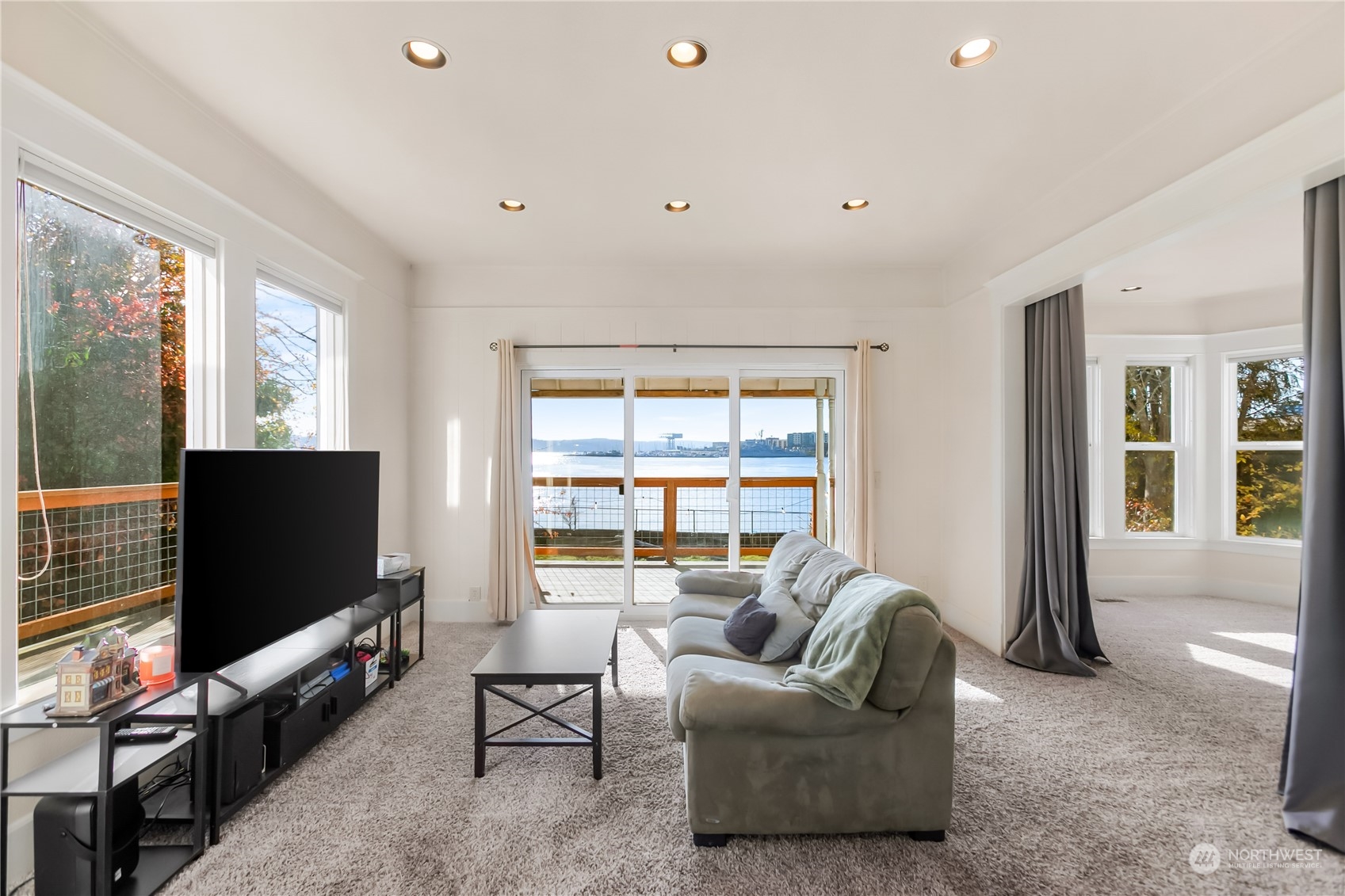 315 Shore Drive Bremerton, WA 98310 - Photo 10 of 38 a living room with furniture and a flat screen tv