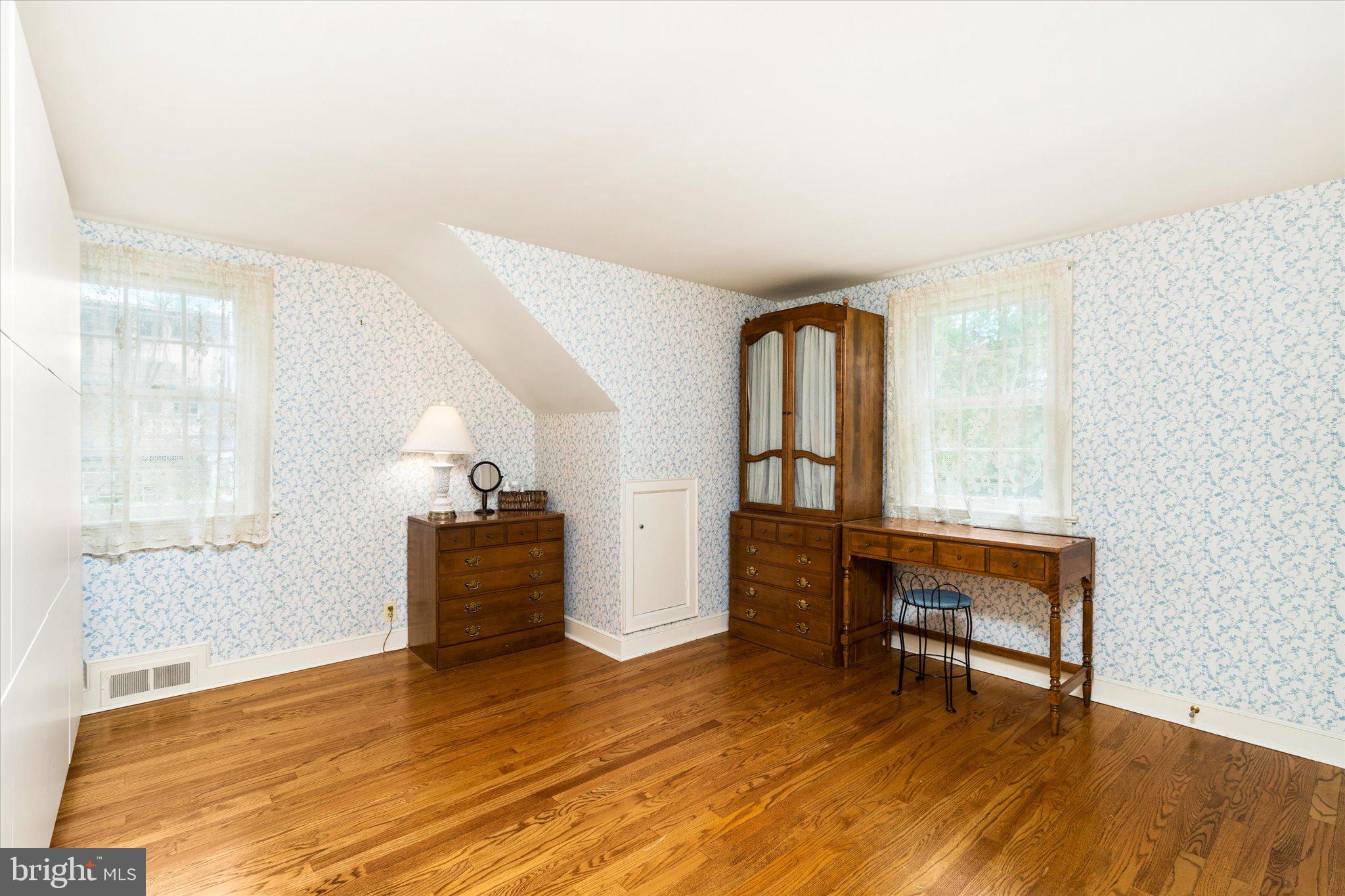 21 Elm Road Princeton, NJ 08540 - Photo 20 of 28 a view of a livingroom with furniture wooden floor windows and staircase