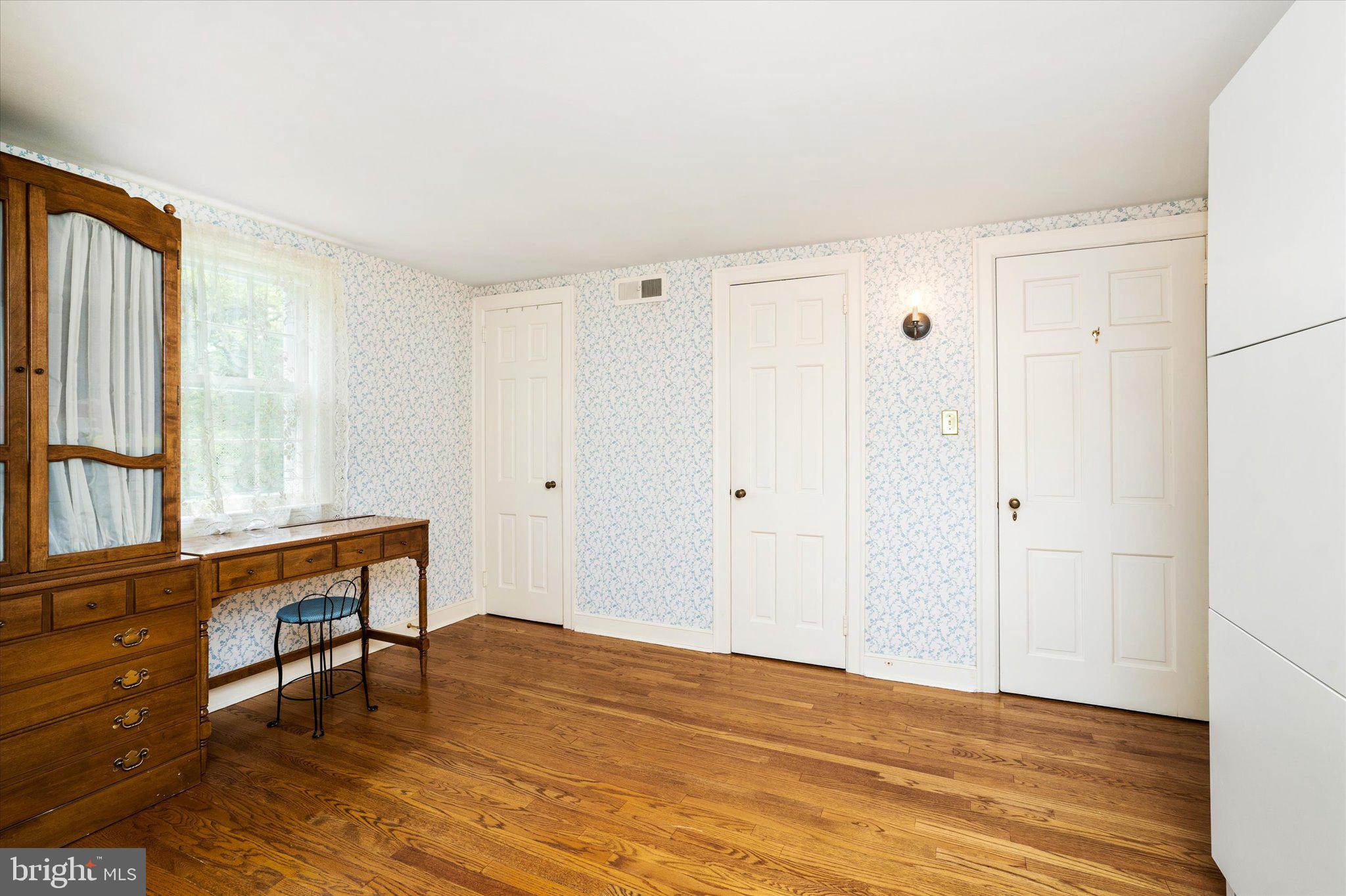 21 Elm Road Princeton, NJ 08540 - Photo 21 of 28 a view of an empty room with window and wooden floor