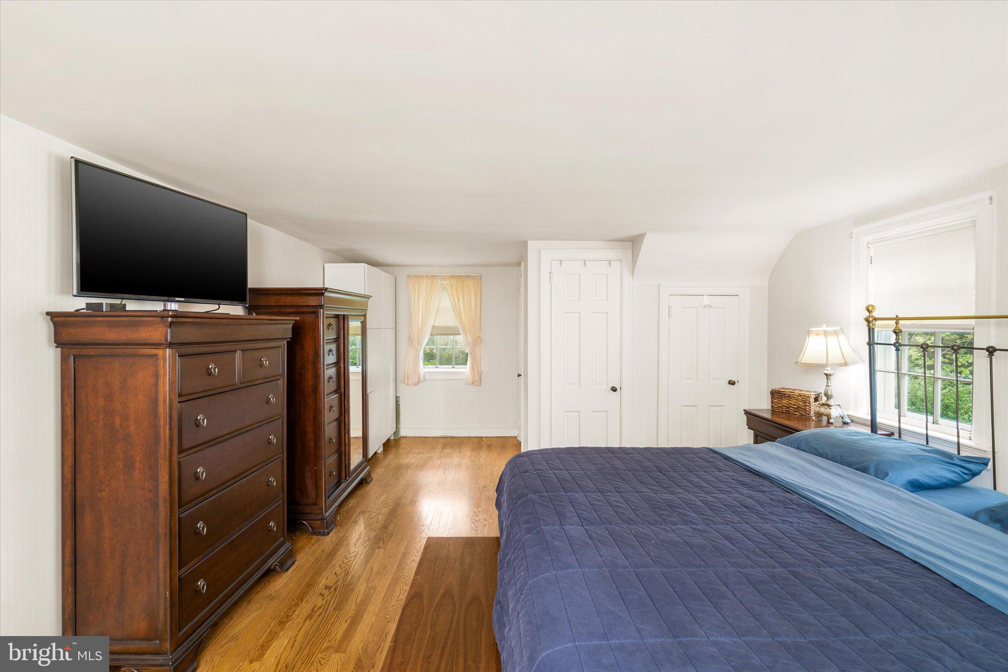 21 Elm Road Princeton, NJ 08540 - Photo 23 of 28 a bedroom with a bed and a flat screen tv
