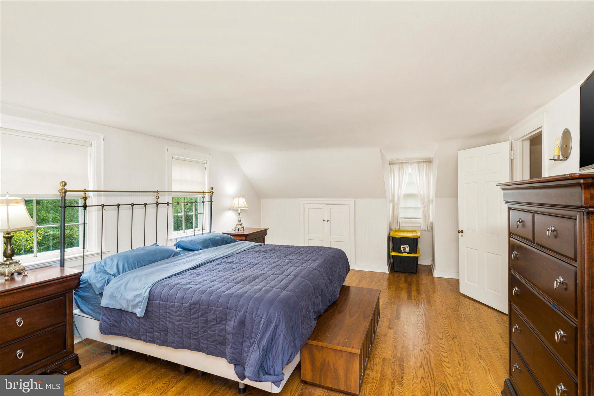 21 Elm Road Princeton, NJ 08540 - Photo 24 of 28 a spacious bedroom with a bed and wooden floor