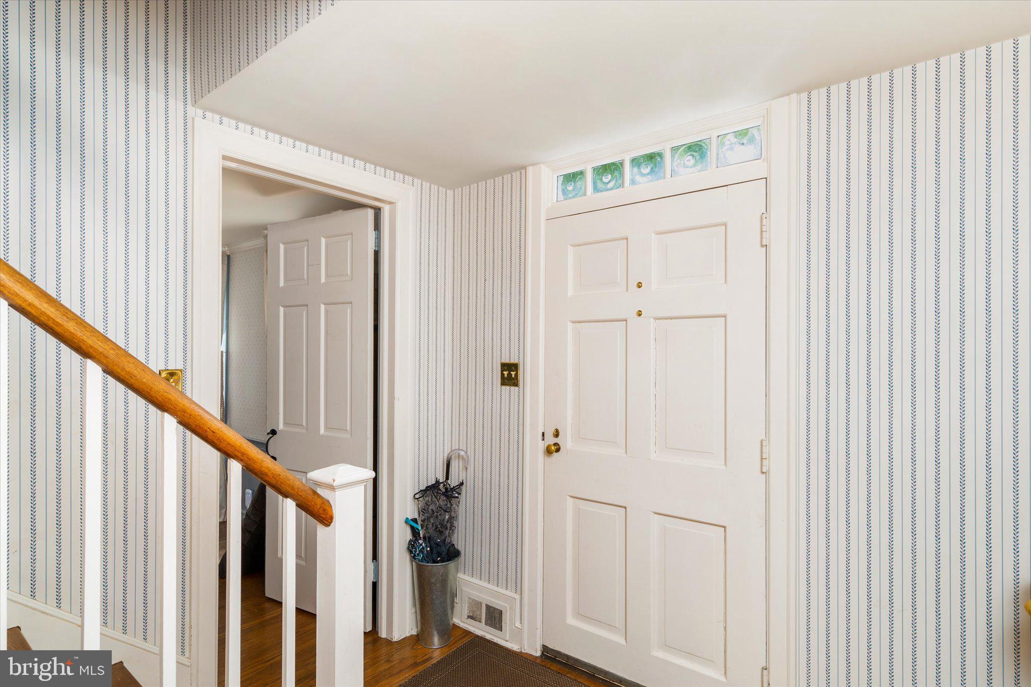 21 Elm Road Princeton, NJ 08540 - Photo 3 of 28 a view of a hallway with wooden floor and entryway